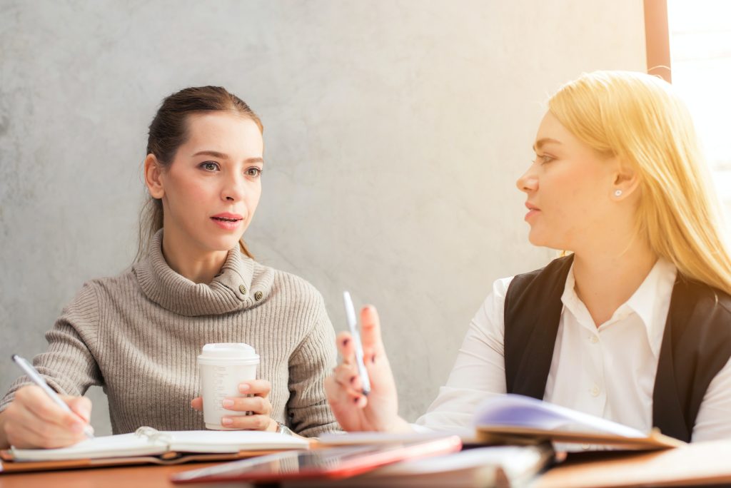 two women in a meeting